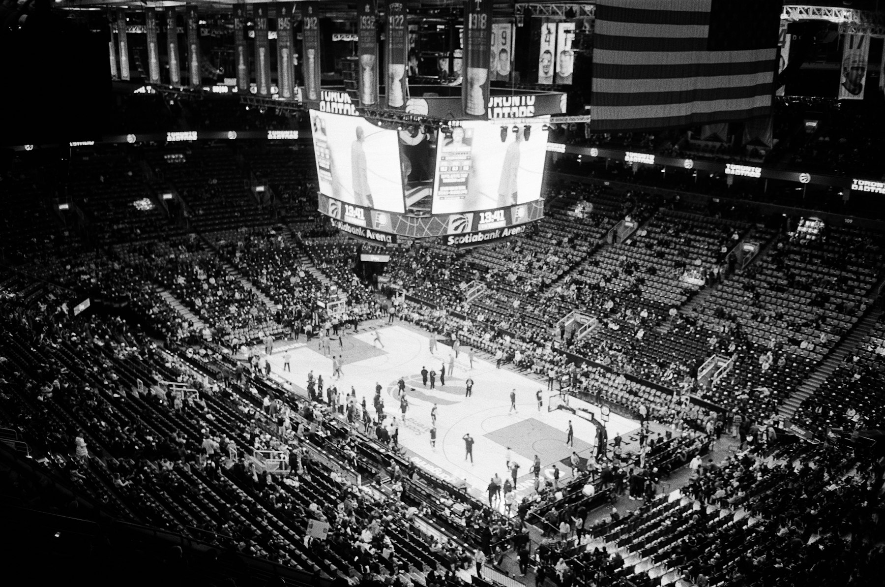Basketball game in a packed indoor arena