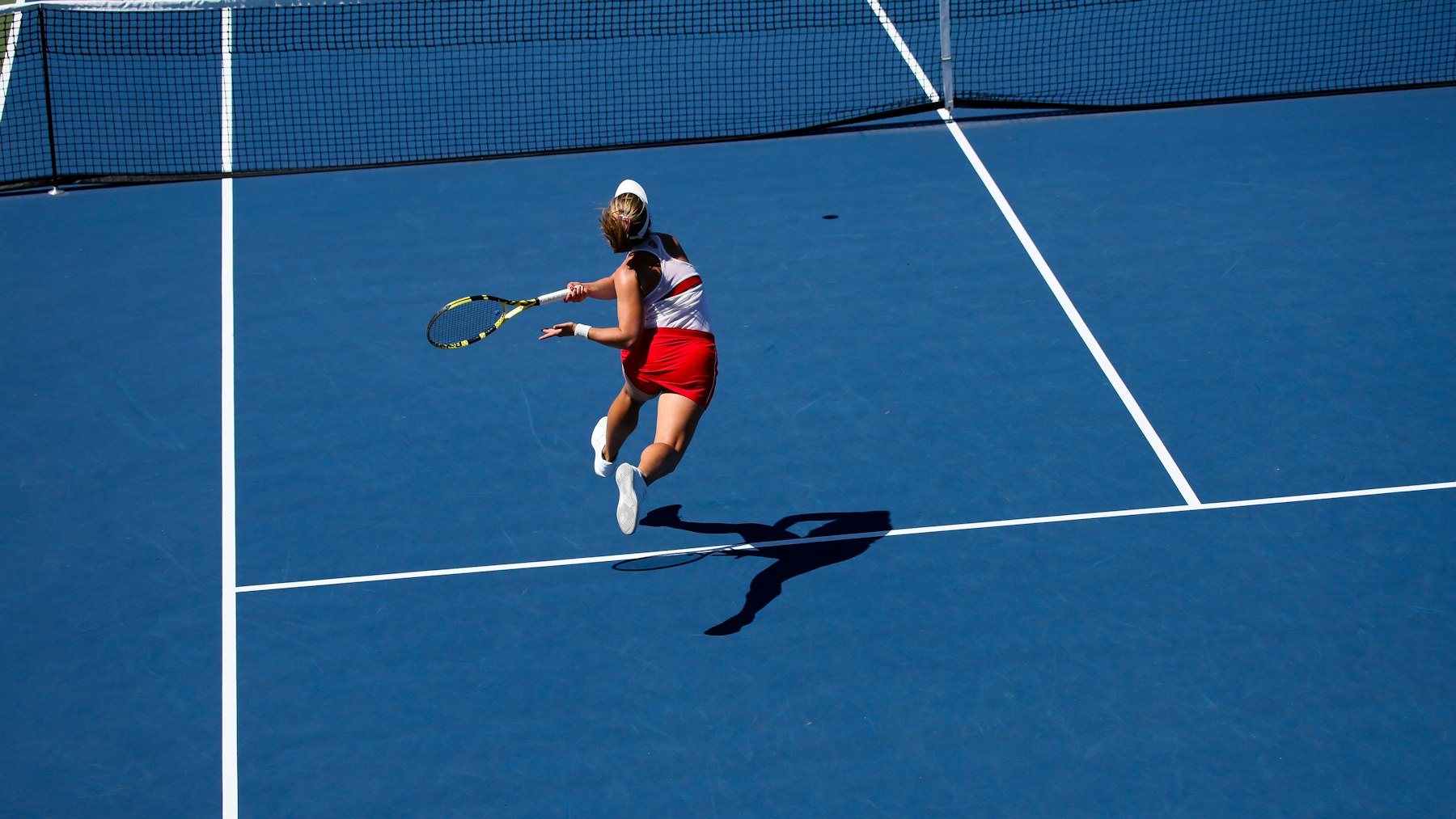 Tennis player competing on a court during a match