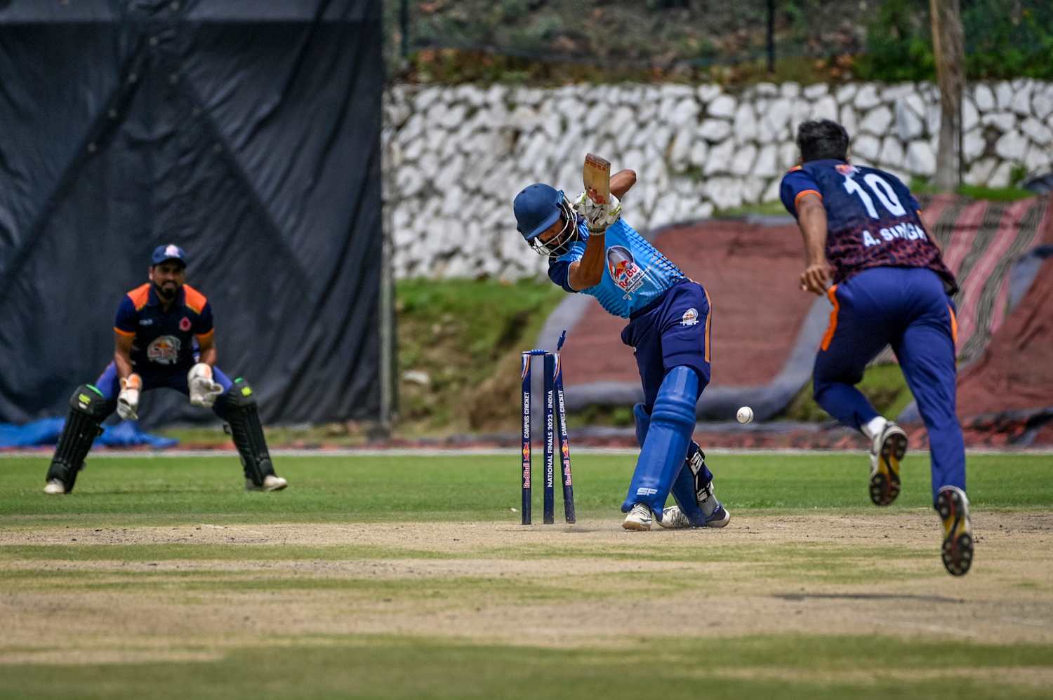 Cricket batsman playing a shot during a competitive match
